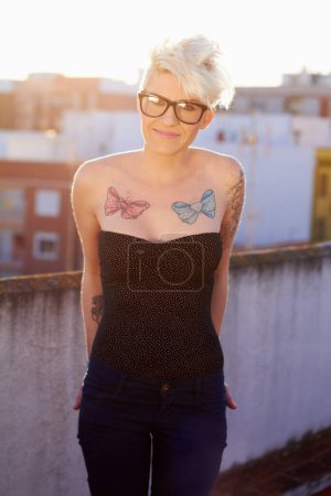 Photo for Punk, tattoo and portrait of woman in city for creative, urban and culture. Happy, pride and identity with rebel female person on rooftop in outdoor for unique, hipster and rocker fashion. - Royalty Free Image