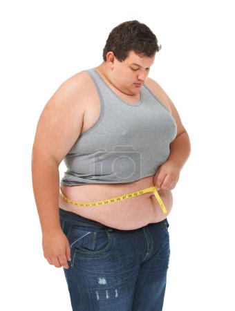 Téléchargez les photos : Obésité, ruban à mesurer sur l'estomac et l'homme vérifier la taille, les soins du corps et isolé sur fond blanc. Homme mesurant l'abdomen pour la progression de la perte de poids, les soins de santé et la motivation en studio. - en image libre de droit