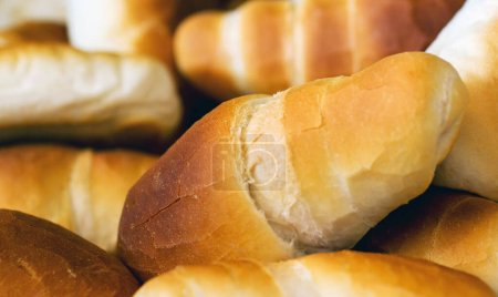 Croissant bread, food and bakery of rolls from cooking, catering service, breakfast or baking meal at cafe. Closeup of fresh baked, bun or roll snack for eating, nutrition or fiber in the restaurant.
