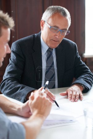 Photo for Planning, businessmen with paperwork and in a business meeting together in a boardroom. Finance support or consulting, collaboration or teamwork and colleagues discussing in a modern workplace office. - Royalty Free Image