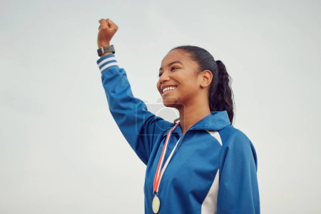 Photo for Happy woman, fist and celebration in sports for winning success or victory achievement on mockup. Female person, athlete or winner with smile in joy for win, award or sport medal on mock up space. - Royalty Free Image