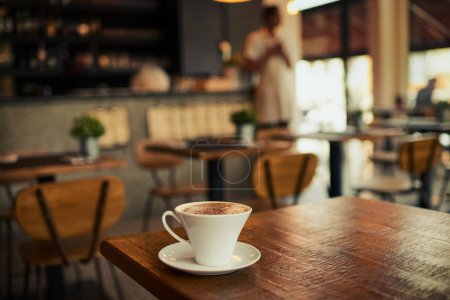 Photo for Wooden table, coffee shop mug and cafe store, restaurant or diner for commerce beverage, drink or retail shopping service. Tea cup, morning espresso or startup small business for fresh caffeine sales. - Royalty Free Image