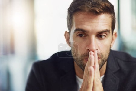 Photo for I hope I get this contract. a businessman looking thoughtful - Royalty Free Image