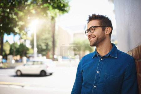Photo for I cant imagine not living in the city. Closeup shot of a handsome middle-aged man spending the day out in the city - Royalty Free Image