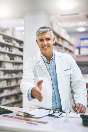 Photo for Senior man, portrait and pharmacist handshake for greeting, introduction or hello in healthcare pharmacy. Happy elderly male person, medical professional or shaking hands for trust, welcome or advice. - Royalty Free Image