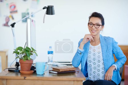 Photo for Business woman, portrait and smile at creative startup, confidence with empowerment in workplace. Confidence, success and career mindset, female professional at desk with ambition at advertising firm. - Royalty Free Image