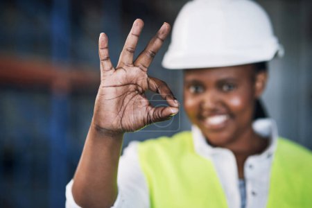 Photo for Black woman, architect and hands with okay sign for construction success, good job or precise on site. Hand of happy African female person engineer showing OK emoji, yes or perfect in architecture. - Royalty Free Image