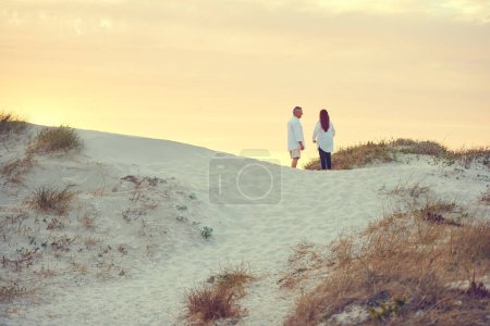 Photo for Breakaway to the beach. mature people standing on a sand dune at the beach - Royalty Free Image
