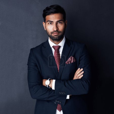 Photo for Solely fixed on corporate success. Studio shot of a confident young businessman posing against a gray background - Royalty Free Image