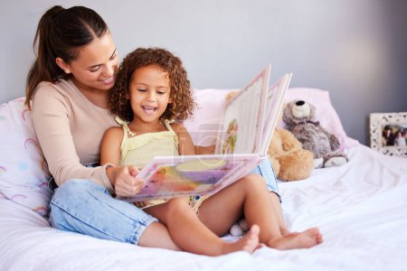 Photo for Learning, book and mother with daughter in bedroom for storytelling, fantasy or creative. Education, study and love with woman reading to young girl in family home for fairytale, literature and relax. - Royalty Free Image