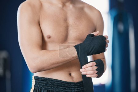 Photo for Sports, boxing and man wrap hands in gym for training, workout and exercise for mma fight. Fitness, body builder and male athlete with bandage prepare for boxer competition, practice and performance. - Royalty Free Image