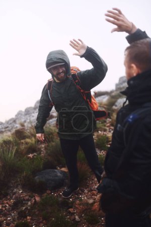 Photo for We made it to the top in one piece. two male friends giving each other a high-five while out hiking in the mountains - Royalty Free Image