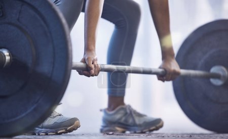 Photo for Gym, woman with barbell for weightlifting and fitness, power and muscle with closeup on hands at sports club. Challenge, zoom and strong female bodybuilder with weights and training with health goals. - Royalty Free Image
