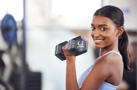 Photo for Portrait of happy woman in gym, dumbbell and mockup for weightlifting, power and muscle at sports club. Balance, fitness and fit female bodybuilder with weights, smile and training with health goals - Royalty Free Image