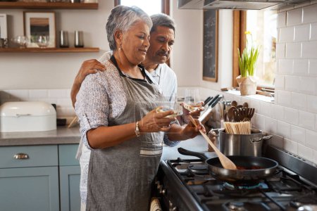Photo for Love, cooking pan and old man with happy woman at oven in kitchen, embrace and healthy marriage bonding in home. Happiness, help and food, senior couple with smile, frying and dinner in retirement - Royalty Free Image