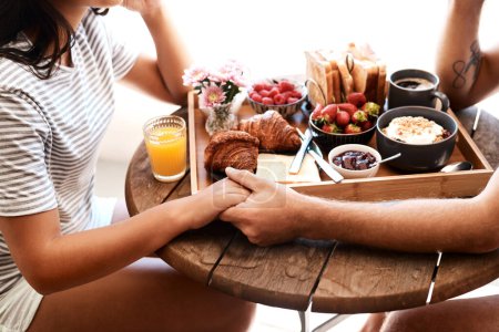 Photo for Restaurant food, breakfast or couple holding hands for support care, security or love on Valentines Day date. Cafe meal, marriage bond and brunch tray of croissant, strawberry or bread in coffee shop. - Royalty Free Image