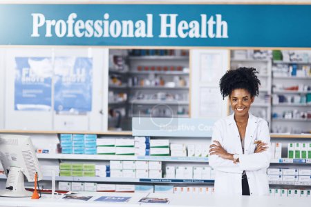Photo for Where youll get professional help. Portrait of a female pharmacist standing with her arms crossed in a chemist - Royalty Free Image