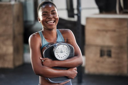 Photo for Fitness, portrait or happy black woman with a scale after body training or gym workout to lose weight. Wellness, laughing or funny girl athlete in health club for exercising progress or results. - Royalty Free Image