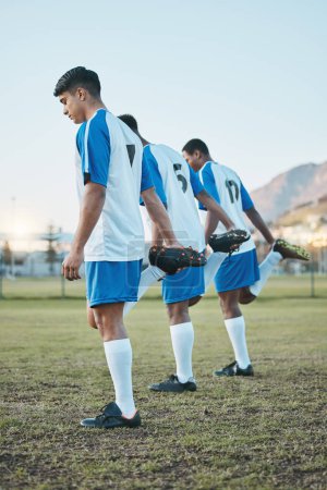 Photo for Sports group, soccer and team stretching legs on field for fitness training or muscle warm up. Football player, club and diversity athlete people with focus on sport competition, workout or challenge. - Royalty Free Image