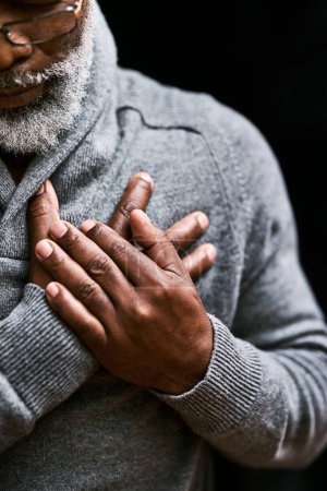 Photo for Hands on chest, heart attack and senior black man with medical emergency in studio isolated on a background. Pain, cardiology and African male person with cardiac arrest, heartburn or stroke problem - Royalty Free Image
