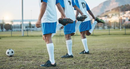 Photo for Soccer, team sports and stretching legs on field for fitness, exercise and training outdoor. Football ball, pitch and club for athlete men together for sport competition, wellness and muscle warm up. - Royalty Free Image