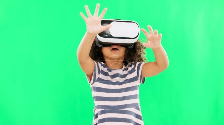 Photo for Metaverse, green screen and girl with virtual reality glasses, futuristic and online games. Young person, female child and kid with vr, gamer and headset for gaming, innovation and digital eyewear. - Royalty Free Image