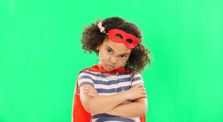 Photo for Child, superhero and hand on green screen to stop crime and fight with fantasy, dream or cosplay costume. Girl power, hero and pretend game with strong kid portrait to protect freedom of imagination. - Royalty Free Image
