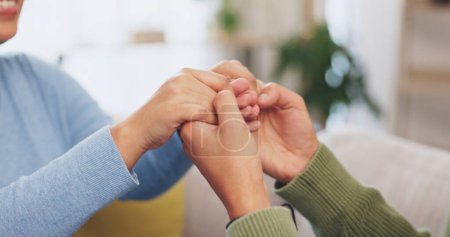 Photo for Couple, people and holding hands for support, love and care of trust together in romantic relationship. Closeup of man, woman and helping hand of life partner, loyalty and commitment of hope at home. - Royalty Free Image