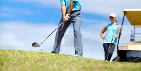 Photo for Low angle, man or golfer playing golf for fitness, workout or exercise to swing with driver on course. Ball, person golfing or hands of athlete training in sports game driving with a club stroke. - Royalty Free Image