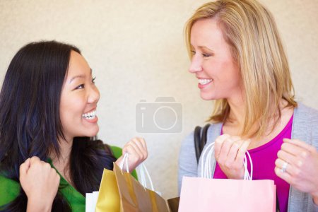 Photo for Smile, bags and women shopping in a city, happy and having fun with retail sale. Happy, spending and excited friends at mall for store discount, items and cheerful with boutique packages or gift. - Royalty Free Image