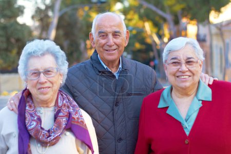 Photo for Senior people, portrait and friends outdoor with a smile, happiness and care for family. Elderly women and an old man together for love, retirement and quality time for bonding, fun and wellness. - Royalty Free Image