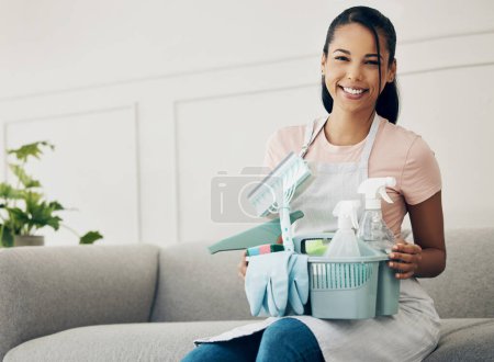 Photo for Woman, cleaning tools and smile in portrait, chemical spray and hygiene with household maintenance product. Happy female cleaner, janitor supplies in basket and clean house, service and detergent. - Royalty Free Image