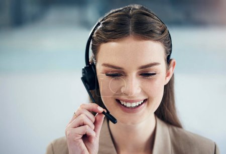 Photo for Contact us, call center and woman with a smile, tech support and conversation with headphones, advice and help. Happy, female person and consultant with a headset, telemarketing and customer service. - Royalty Free Image