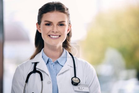 Photo for Portrait, happy woman or proud doctor in hospital to help with confidence, smile or positive mindset. Face, mockup or friendly medical healthcare professional smiling with nursing success in clinic. - Royalty Free Image
