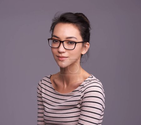 Photo for Portrait, fashion glasses and serious woman in studio isolated on a gray background mockup space. Face, nerd and female geek, person or model from Canada with trendy clothes, eyewear and casual style. - Royalty Free Image