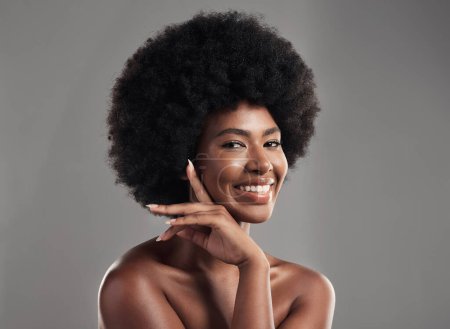 Photo for Beauty, skincare and portrait of happy woman with afro, cosmetics and dermatology on grey background. Natural skin care, studio and African model with smile on face, salon makeup glow and wellness - Royalty Free Image