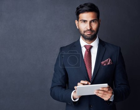 Photo for Portrait, businessman or tablet in studio, mockup space or background for trading, planning or research. Corporate trader, serious indian man in suit or digital technology of online stocks investment. - Royalty Free Image