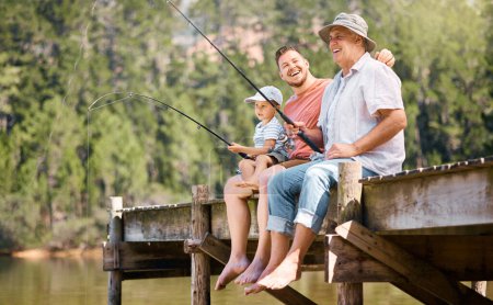 Happy father, grandfather and child fishing at lake together for fun bonding or peaceful time in nature. Dad, grandpa and kid enjoying life, catch or fish with rod by water pond or river in forest.