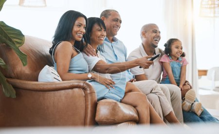 Photo for Happy, TV and family on sofa with remote for bonding, quality time and relaxing in living room. Grandparents with mother, father and child on couch streaming comedy movies, entertainment and series. - Royalty Free Image