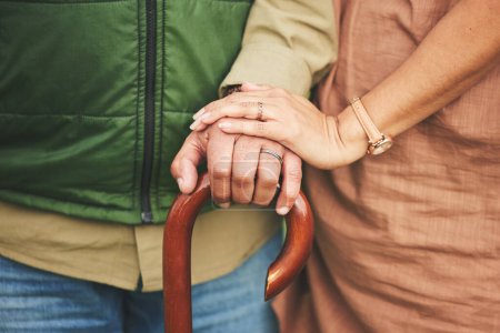 Photo for Closeup, hands and couple with support, cane and retirement with solidarity, marriage or appreciation. Zoom, touching or senior man with old woman, love or care with empathy, understanding or comfort. - Royalty Free Image