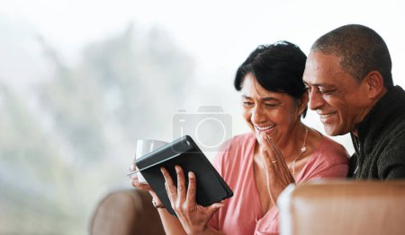 Photo for Relax, wave and video call with old couple and tablet on sofa for communication, social media or networking. Technology, contact and mockup with senior man and woman in living room at home for search. - Royalty Free Image
