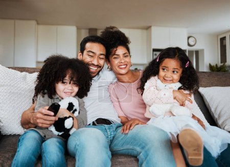 Photo for Portrait of mom, dad and kids on sofa, watching tv and happy family bonding together in living room. Smile, happiness and parents relax with children on couch, streaming television show or movies - Royalty Free Image