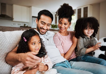 Photo for Mom, dad and happy kids on couch, watching tv and family bonding together in living room. Smile, happiness and parents relax with children on sofa, streaming television show subscription or movies - Royalty Free Image