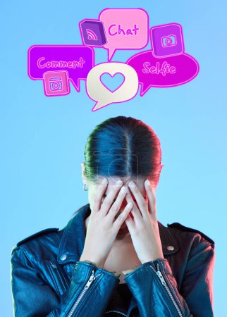 Photo for Woman, speech bubble and anxiety in studio, thinking and overwhelmed with technology by blue background. Gen z student girl, 3d icon and social media notification with stress, worry and mental health. - Royalty Free Image