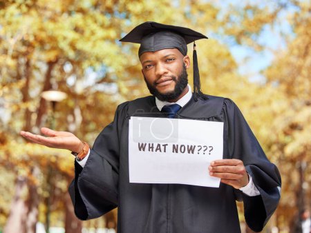 Photo for Paper sign, graduation and portrait of a man in a garden by his college campus with a confused gesture. Doubt, graduate and African male student with poster and shrug expression outdoor at university. - Royalty Free Image