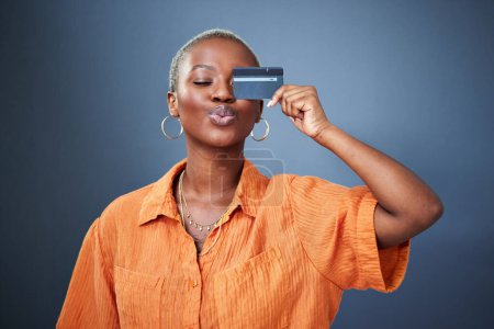 Photo for Shopping, credit card and black woman in studio for banking, savings and budget on grey background. Investment, cashback and African female satisfied with membership, payment or customer experience. - Royalty Free Image