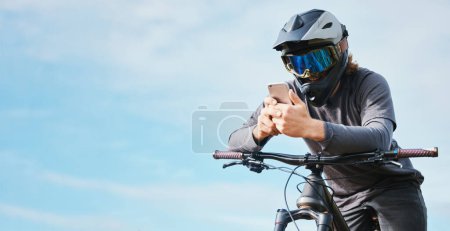 Photo for Phone, mockup and cyclist on a bicycle typing social media, online or internet for bike extreme sports communication. Outdoor, fitness and biker or person texting or search the web or website. - Royalty Free Image