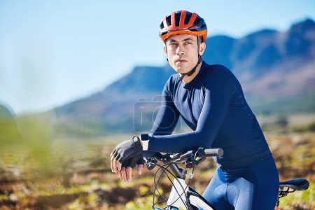 Photo for Relax, thinking or man cycling on a bicycle for training, cardio workout and exercise on mountain road. Fitness, energy recovery or tired sports athlete biker resting on a break or trail adventure. - Royalty Free Image