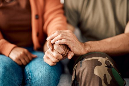 Photo for Marriage, holding hands and couple on sofa in therapy for argument, problem advice and divorce counseling. Psychology, mental health and woman with military man on couch for ptsd, help and support. - Royalty Free Image