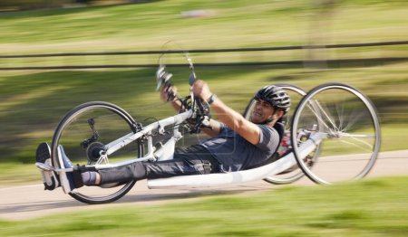 Photo for Cycling, fitness and fast with man and handcycle in nature for training, sports and challenge. Exercise, workout and cardio with person with a disability in park for motion blur, marathon and health. - Royalty Free Image